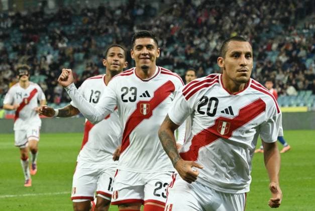 Russia Soccer Friendly Chile - Peru 9049869 18.11.2025 Peru s Alex Valera, right, celebrates his goal with Cesar Inga, centre, and Jhonny Vidales during the friendly soccer match between Chile and Peru at the Fisht Olympic Stadium, in the Sirius Federal Territory, Krasnodar Region, Russia. Ekaterina Lyzlova Sputnik Sochi Russia  Copyright: xEkaterinaxLyzlovax