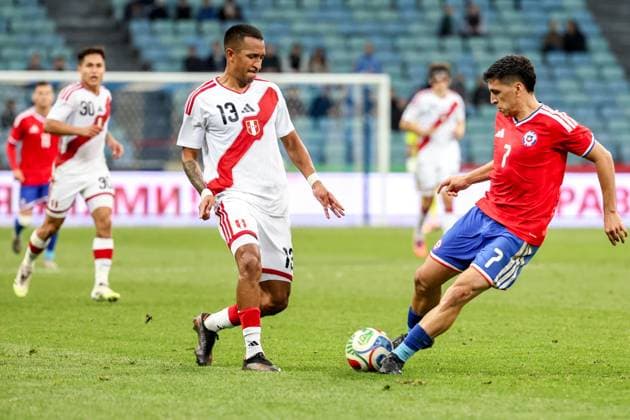 RUSSIA, SOCHI - NOVEMBER 18, 2025: Peru s Jhonny Vidales (L) and Chile s Marcelino Nunez are in action in a friendly football match between the Chilean and the Peruvian men s national football teams at Fisht Stadium International Football Friendly: Chile 2 - 1 Peru  - ZUMAt113 20251118_zaa_t113_706 Copyright: xDmitryxFeoktistovx
