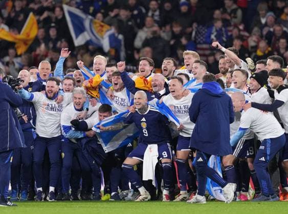 The Scotland players celebrate on the pitch after beating Denmark 4-2 to qualify for FIFA World Cup, WM, Weltmeisterschaft, Fussball 2026. Scotland v Denmark, FIFA 2026 World Cup Qualifying, Group C, Football, Hampden Park, Glasgow, Scotland, UK - 18 Nov 2025Glasgow Hampden Park United Kingdom EDITORIAL USE ONLY No use with unauthorised audio, video, data, fixture lists, club league logos or live services. Online in-match use limited to 120 images, no video emulation. No use in betting, games or single club league player publications. Copyright: xStuartxWallace Shutterstockx 15846619ca