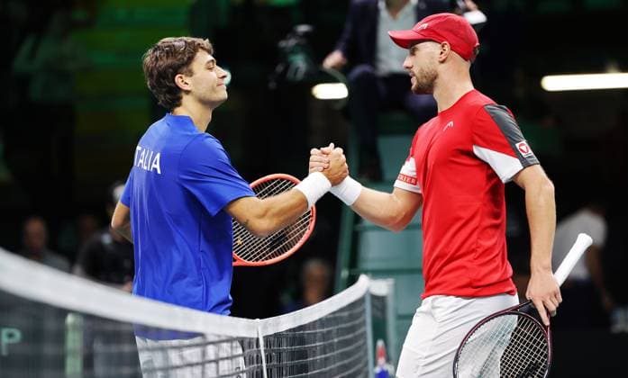 TENNIS - Davis Cup Final 8 BOLOGNA,ITALY,19.NOV.25 - TENNIS - ITF Davis Cup, Final 8, Italy vs Austria. Image shows Flavio Cobolli (ITA) and Filip Misolic (ITA).  GEPAxpictures xMatthiasxHauer