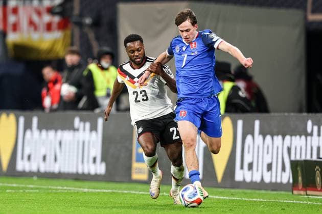 November 17, 2025, Leipzig, Germany: Ridle Baku of Germany (L) and Leo Sauer of Slovakia seen in action during European World Cup Qualifiers 2026 football match between Germany and Slovakia at RedBull (Leipzig). Final score Germany 6 : 0 Slovakia. Leipzig Germany - ZUMAs197 20251117_aaa_s197_345 Copyright: xGrzegorzxWajdax