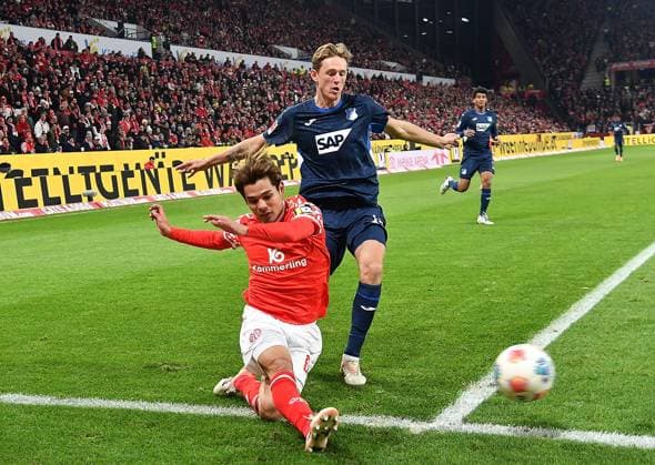 21.11.2025, xhbx, Fussball 1.Bundesliga, FSV Mainz 05 - TSG Hoffenheim v.l. Kaishu Sano (FSV Mainz 05), Wouter Burger (TSG 1899 Hoffenheim) (DFL DFB REGULATIONS PROHIBIT ANY USE OF PHOTOGRAPHS as IMAGE SEQUENCES and or QUASI-VIDEO) Mainz
