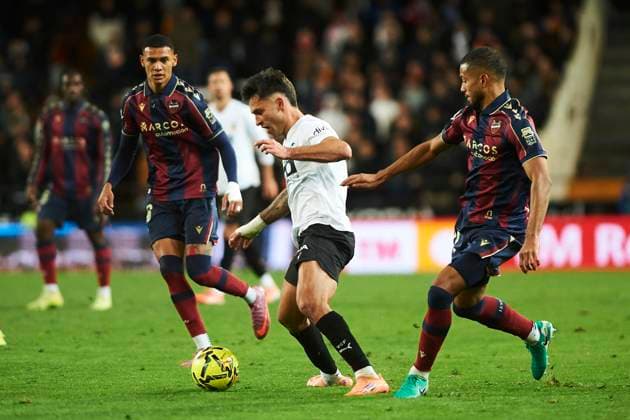 Hugo Duro (Valencia CF) and Jeremy Toljan (Levante UD) during the LaLiga EA Sports match between Valencia CF and Levante UD at Estadio de Mestalla on December 21, 2025 in Valencia, Spain. (Photo by Maria Jose Segovia DeFodi Images)