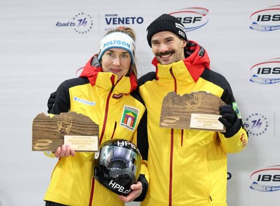 (251122) -- CORTINA D AMPEZZO, Nov. 22, 2025 -- Second-placed Jacqueline Pfeifer (L) Axel Jungk of Germany celebrate during the awarding ceremony of the ISBF World Cup Skeleton Mixed Team match in Cortina D Ampezzo, Italy, Nov. 21, 2025. ) (SP)ITALY-CORTINA D AMPEZZO-ISBF WORLD CUP-SKELETON MIXED TEAM LixJing 