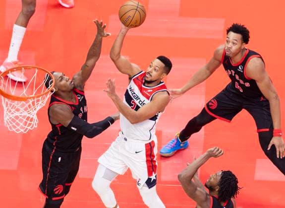 (251122) -- TORONTO, Nov. 22, 2025 -- CJ McCollum (C) of Washington Wizards goes up for a layup as RJ Barrett (L) of Toronto Raptors defends during the 2025-2026 NBA, Basketball Herren, USA Cup group match between Toronto Raptors and Washington Wizards in Toronto, Canada, Nov. 21, 2025. (Photo by Xinhua) (SP)CANADA-TORONTO-NBA CUP-WIZARDS VS RAPTORS ZouxZheng 