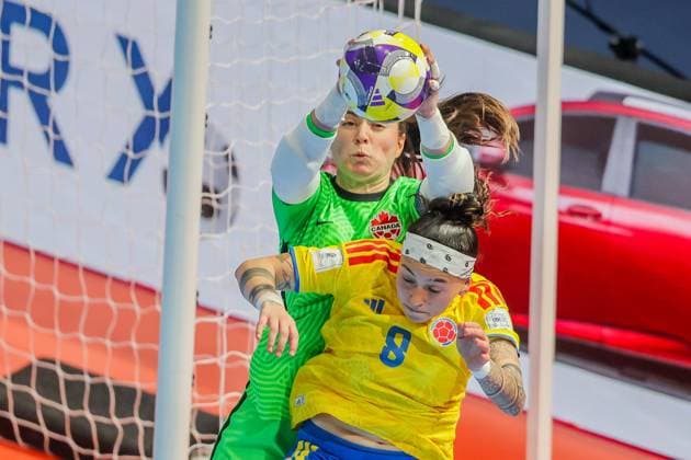 (251122) -- PASIG CITY, Nov. 22, 2025 -- Goalkeeper Lea Palacio-Tellier (Back) of Canada vies against Angely Camargo (Front) of Colombia during the match between Colombia and Canada at the FIFA Futsal Women s World Cup 2025 in Pasig City, the Philippines, Nov. 22, 2025. ) (SP)PHILIPPINES-PASIG CITY-FUTSAL-WOMEN S WORLD CUP 2025-COLOMBIA VS CANADA RouellexUmali 
