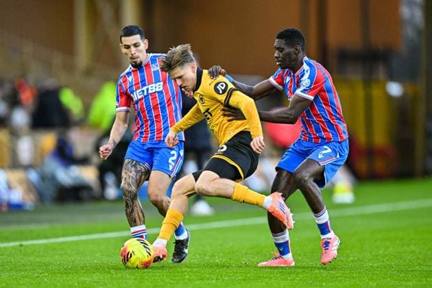 22nd November 2025; Molineux Stadium, Wolverhampton, West Midlands, England; Premier League Football, Wolverhampton Wanderers versus Crystal Palace; David Moller Wolfe of Wolverhampton Wanderers holds off Ismaila Sarr of Crystal Palace  GodfreyxPitt