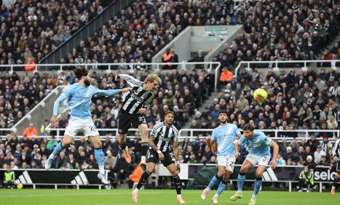 Newcastle Upon Tyne, England, 22nd November 2025. Nick Woltemade of Newcastle United header saved during the Newcastle United vs Manchester City Premier League match at St. James Park, Newcastle Upon Tyne. Picture credit should read: Nigel Roddis Sportimage EDITORIAL USE ONLY. No use with unauthorised audio, video, data, fixture lists, club league logos or live services. Online in-match use limited to 120 images, no video emulation. No use in betting, games or single club league player publications. SPI_017_NR_NEWC_MANC SPI-4304-0017