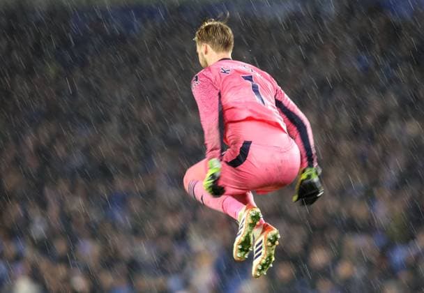 Brighton v Brentford 21 November 2025, Brighton - Premier League Football - Brighton & Hove Albion v Brentford - Brentford goalkeeper Caoimhin Kelleher jumps to keep warm in the pouring rain - Photo: Charlotte Wilson Offside. Brighton UK Copyright: xCharlottexWilsonx xOffsidexOffside