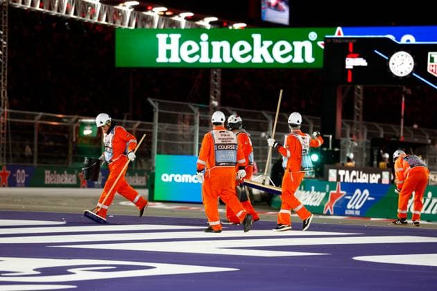LAS VEGAS, NV - NOVEMBER 22: Course intervention marshals clean up debris after a crash on lap one during the the Formula 1 Las Vegas Grand Prix on November 22, 2025 on the Las Vegas Strip Circuit in Las Vegas, Nevada.(Photo by Jeff Speer Icon Sportswire) AUTO: NOV 22 F1 Las Vegas Grand Prix EDITORIAL USE ONLY Icon2511220631