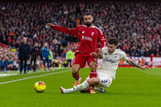 (251123) -- LONDON, Nov. 23, 2025 -- Liverpool s Mohamed Salah (L) vies with Nottingham Forest s Neco Williams during the English Premier League match between Liverpool FC and Nottingham Forest FC in Liverpool, Britain, on Nov. 22, 2025. FOR EDITORIAL USE ONLY. NOT FOR SALE FOR MARKETING OR ADVERTISING CAMPAIGNS. NO USE WITH UNAUTHORIZED AUDIO, VIDEO, DATA, FIXTURE LISTS, CLUB LEAGUE LOGOS OR LIVE SERVICES. ONLINE IN-MATCH USE LIMITED TO 45 IMAGES, NO VIDEO EMULATION. NO USE IN BETTING, GAMES OR SINGLE CLUB LEAGUE PLAYER PUBLICATIONS. (SP)BRITAIN-LONDON-FOOTBALL-ENGLISH PREMIER LEAGUE-LIVERPOOL VS NOTTINGHAM FOREST LixYing 