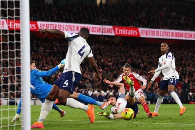 Leandro Trossard of Arsenal scores a goal to make it 1-0 - Arsenal v Tottenham Hotspur, Premier League, Emirates Stadium, London, UK - 23rd November 2025 Editorial Use Only - DataCo restrictions apply Arsenal v Tottenham Hotspur, Premier League, Football, Emirates Stadium, London, UK - 23 Nov 2025London Emirates Stadium United Kingdom EDITORIAL USE ONLY No use with unauthorised audio, video, data, fixture lists, club league logos or live services. Online in-match use limited to 120 images, no video emulation. No use in betting, games or single club league player publications. Copyright: xMDI Shutterstockx 15874294d
