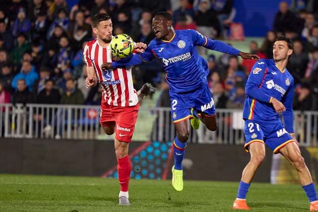 Clement Lenglet (Atletico de Madrid) and Dakonam Ortega Djene (Getafe CF) battle for the ball during the LaLiga EA Sports match between Getafe CF v AtlÃ tico Madrid at Coliseum on November 23, 2025 in Getafe, Spain. (Photo by Manu Reino DeFodi Images)