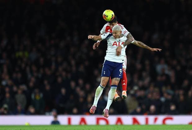 Richarlison of Tottenham Hotspur competes for the ball with Piero Hincapie of Arsenal Arsenal v Tottenham Hotspur, Premier League, Football, Emirates Stadium, London, UK - 23 Nov 2025London Emirates Stadium United Kingdom EDITORIAL USE ONLY No use with unauthorised audio, video, data, fixture lists, club league logos or live services. Online in-match use limited to 120 images, no video emulation. No use in betting, games or single club league player publications. Copyright: xMichaelxZemanek Shutterstockx 15860967ay