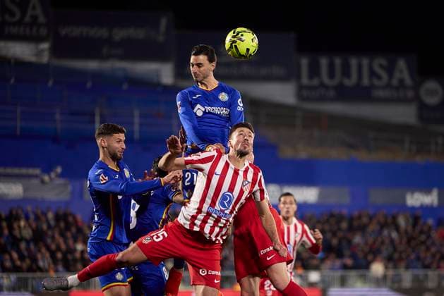 Juan Iglesias (Getafe CF) and Clement Lenglet (Atletico de Madrid) battle for the ball during the LaLiga EA Sports match between Getafe CF v AtlÃ tico Madrid at Coliseum on November 23, 2025 in Getafe, Spain. (Photo by Manu Reino DeFodi Images)
