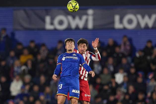 Adrian Liso (Getafe CF) and Jose Maria Gimenez (Atletico de Madrid) battle for the ball during the LaLiga EA Sports match between Getafe CF v AtlÃ tico Madrid at Coliseum on November 23, 2025 in Getafe, Spain. (Photo by Manu Reino DeFodi Images)
