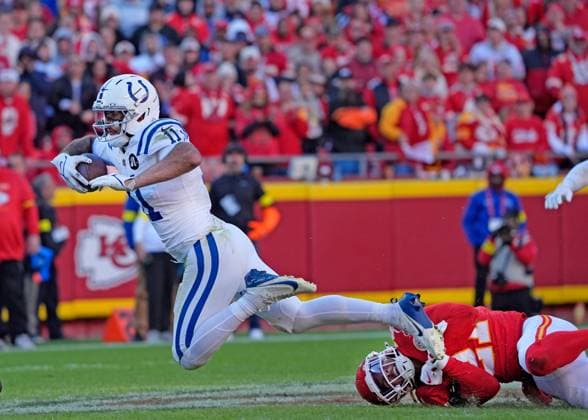 Indianapolis Colts wide receiver Michael Pittman (11) is stopped by Kansas City Chiefs safety Jaden Hicks (21) after a gain of 6 yards at Arrowhead Stadium in Kansas City, Missouri on Sunday, November 23, 2025.  KCP2025112306 JONxROBICHAUD