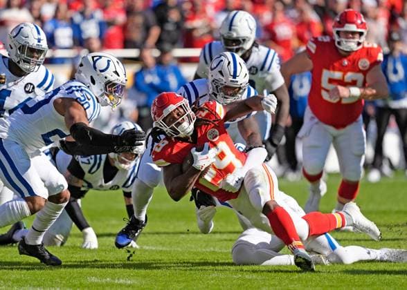 Kansas City Chiefs running back Kareem Hunt (29) is tackled after a gain of 9 at Arrowhead Stadium in Kansas City, Missouri on Sunday, November 23, 2025.  KCP2025112316 JONxROBICHAUD