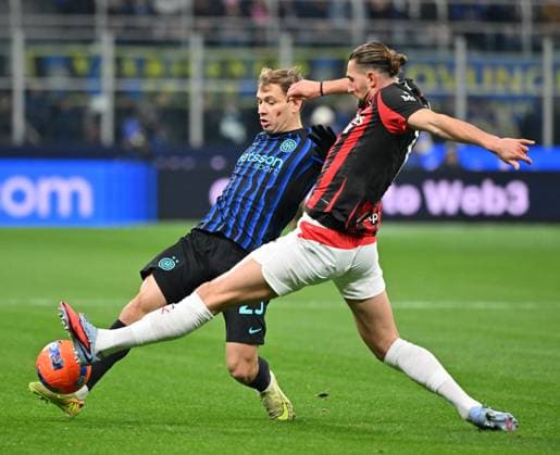(251124) -- MILAN, Nov. 24, 2025 -- Inter Milan s Nicolo Barella (L) vies with AC Milan s Adrien Rabiot during a Serie A football match between Inter Milan and AC Milan in Milan, Italy, Nov. 23, 2025. (Photo by Xinhua) (SP)ITALY-MILAN-FOOTBALL-SERIE A-INTER MILAN VS AC MILAN AlbertoxLingria 