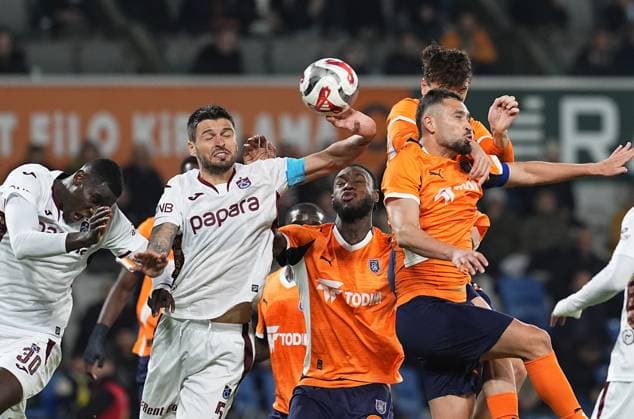 RAMS Basaksehir v Trabzonspor - Turkish Super Lig ISTANBUL, TURKIYE - NOVEMBER 24: Trabzonspor player Okay Yokustu rises for an aerial challenge as the ball appears to make contact with his hand during the Turkish Super Lig week 13 football match between RAMS Basaksehir and Trabzonspor at Basaksehir Fatih Terim Stadium in Istanbul, Turkiye, on November 24, 2025. Esra Bilgin Anadolu Istanbul Turkey. Editorial use only. Please get in touch for any other usage.  Copyright: x2025xAnadoluxEsraxBilginx