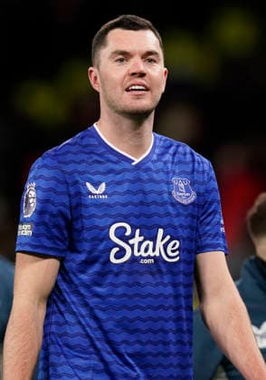 Manchester, England, 24th November 2025. Michael Keane of Everton smiling on the final whistle following his clash with a team mate leading to Idrissa Gueye of Everton earning a red card during the Manchester United, ManU vs Everton Premier League match at Old Trafford, Manchester. Picture credit should read: Andrew Yates Sportimage EDITORIAL USE ONLY. No use with unauthorised audio, video, data, fixture lists, club league logos or live services. Online in-match use limited to 120 images, no video emulation. No use in betting, games or single club league player publications. SPI_106_AY_Manchester_Utd_Everton SPI-4308-0101