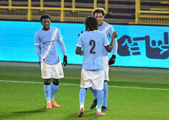 Manchester, England, 25th November 2025. Floyd Samba of Manchester City celebrates scoring his sides fifth goal during the Manchester City U19 vs Bayer Leverkusen U19 UEFA Youth League match at the Academy Stadium, Manchester. Picture credit should read: Cody Froggatt Sportimage EDITORIAL USE ONLY. No use with unauthorised audio, video, data, fixture lists, club league logos or live services. Online in-match use limited to 120 images, no video emulation. No use in betting, games or single club league player publications. SPI_017_CF_MANCHESTER_CITY_U19_V_BAYER_LEVERKUSEN_U19 SPI-4326-0017