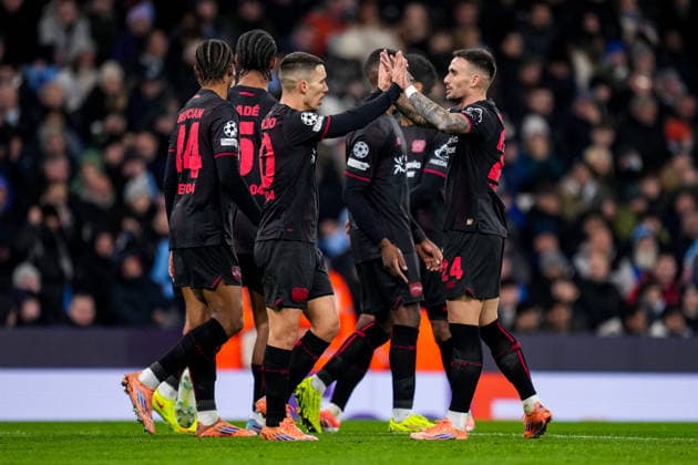 MANCHESTER, ENGLAND - NOVEMBER 25: Alejandro Grimaldo of Bayer 04 Leverkusen celebrates with Aleix Garcia of Bayer 04 Leverkusen after scoring his team s first goal during the UEFA Champions League 2025 26 League Phase MD5 match between Manchester City and Bayer 04 Leverkusen at City of Manchester Stadium on November 25, 2025 in Manchester, England. (Photo by Rene Nijhuis) SPO  Copyright: xRenexNijhuis