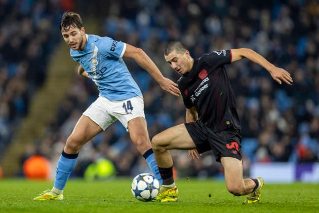 25th November 2025; Etihad Stadium, Manchester, England; UEFA Champions League Football, Manchester City versus Bayer Leverkusen; Ibrahim Maza of Bayer Leverkusen under pressure from Nico Gonzalez of Manchester City  TimxWilliams