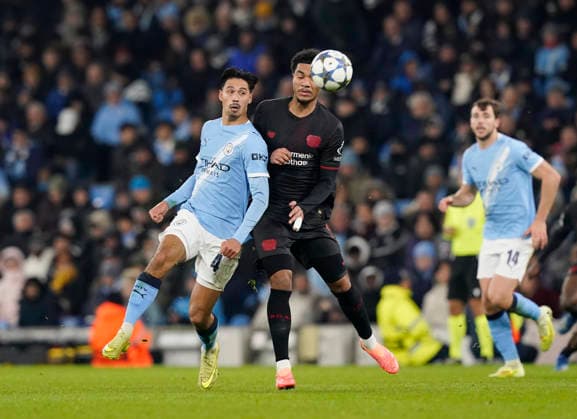 Manchester, England, 25th November 2025. Tijjani Reijnders of Manchester City and Malik Tillman of Bayer Leverkusen during the Manchester City vs Bayer Leverkusen UEFA Champions League match at the Etihad Stadium, Manchester. Picture credit should read: Andrew Yates Sportimage EDITORIAL USE ONLY. No use with unauthorised audio, video, data, fixture lists, club league logos or live services. Online in-match use limited to 120 images, no video emulation. No use in betting, games or single club league player publications. SPI_055_AY_Man_City_Leverkusen SPI-4309-0075