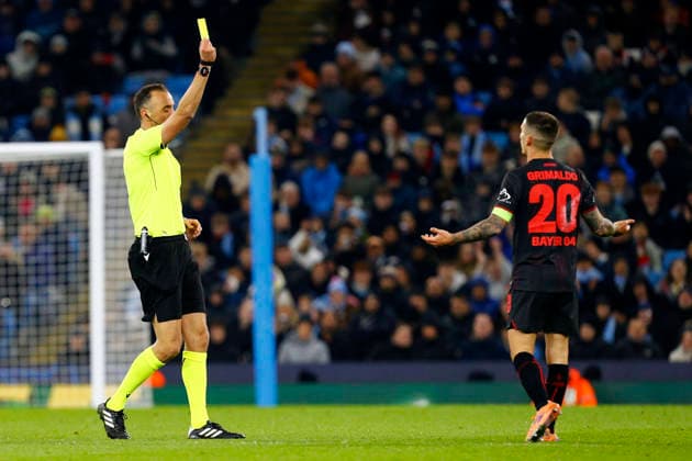 Manchester City v Bayer Leverkusen, Manchester, UK - 25 November 2025 Alex Grimaldo of Bayer Leverkusen is shown a yellow card by referee Joao Pinheiro during the UEFA Champions League match between Manchester City and Bayer Leverkusen at The Etihad Stadium on 25 November 2025 in Manchester, England (Photo by Steve Taylor PPAUK) Manchester The Etihad Stadium Greater Manchester England Copyright: xStevexTaylor PPAUKx PPA-231775