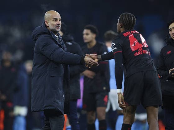 Manchester City v Bayer Laverkusen, UEFA Champions League, League Phase 25.11.25 Manchester City v Bayer Laverkusen, UEFA Champions League, League Phase Bradley Ormesher The Times Pep Guardiola manager of Manchester City at end of match with Jeanuël Belocian of Leverkusen  Copyright: xBradleyxOrmesherx NINTCHDBPICT001041061784