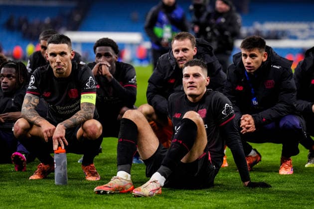 MANCHESTER, ENGLAND - NOVEMBER 25: Alejandro Grimaldo of Bayer 04 Leverkusen and Patrik Schick of Bayer 04 Leverkusen sit on the ground after their team???s win after the UEFA Champions League 2025 26 League Phase MD5 match between Manchester City and Bayer 04 Leverkusen at City of Manchester Stadium on November 25, 2025 in Manchester, England. (Photo by Rene Nijhuis) SPO  Copyright: xRenexNijhuis