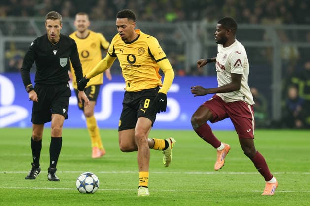 (251126) -- DORTMUND, Nov. 26, 2025 -- Felix Nmecha (C) of Borussia Dortmund vies with Thomas Partey (R) of Villarreal CF during the UEFA Champions League group stage 5th round match between Borussia Dortmund and Villarreal CF in Dortmund, Germany, Nov. 25, 2025. (Photo by Xinhua) (SP)GERMANY-DORTMUND-FOOTBALL-UEFA CHAMPIONS LEAGUE-DORTMUND VS VILLARREAL CF JoachimxBywaletz 