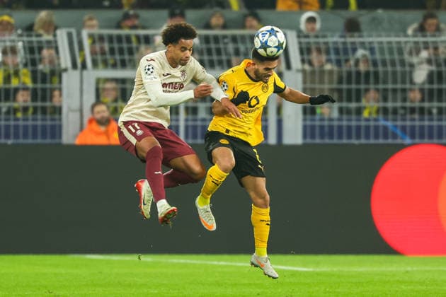 (251126) -- DORTMUND, Nov. 26, 2025 -- Yan Couto (R) of Borussia Dortmund and Tajon Buchanan of Villarreal CF head for the ball during the UEFA Champions League group stage 5th round match between Borussia Dortmund and Villarreal CF in Dortmund, Germany, Nov. 25, 2025. (Photo by Xinhua) (SP)GERMANY-DORTMUND-FOOTBALL-UEFA CHAMPIONS LEAGUE-DORTMUND VS VILLARREAL CF JoachimxBywaletz 