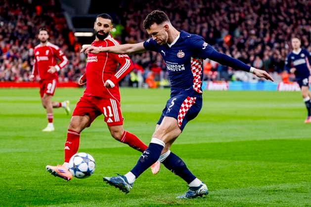 Ivan Perisic of PSV Eindhoven passes the ball under pressure from Mohamed Salah of Liverpool FC Liverpool FC v PSV Eindhoven, UEFA Champions League 2025 26 League Phase MD5, Liverpool FC v PSV Eindhoven, Anfield, November 26, 2025, Liverpool, United Kingdom.