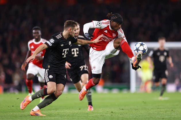 Arsenal v Bayern Munich 26 November 2025, London - UEFA Champions League - League Stage - Arsenal v Bayern Munich - Josip Stanisic of Bayern Munich and Noni Madueke of Arsenal - Photo: Jacques Feeney Offside. London UK Copyright: xJacquesxFeeneyxOffside