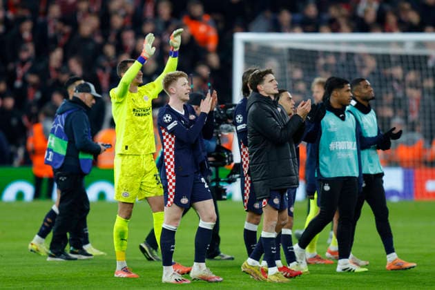 Liverpool, England, 26th November 2025. PSV Eindhoven players celebrate after the Liverpool vs PSV Eindhoven UEFA Champions League match at Anfield, Liverpool. Picture credit should read: James Baylis Sportimage EDITORIAL USE ONLY. No use with unauthorised audio, video, data, fixture lists, club league logos or live services. Online in-match use limited to 120 images, no video emulation. No use in betting, games or single club league player publications. SPI_074_JB_Liverpool_PSV SPI-4311-0074