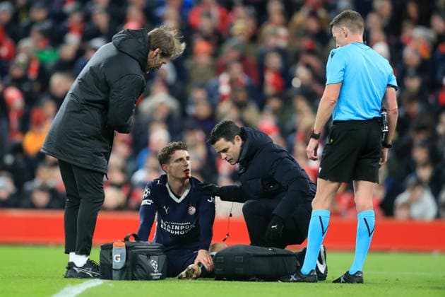 26th November 2025; Anfield, Liverpool, Merseyside, England; UEFA Champions League Football, Liverpool versus PSV Eindhoven; Joey Veerman of PSV Eindhoven receives treatment for a facial injury  DavidxBlunsden