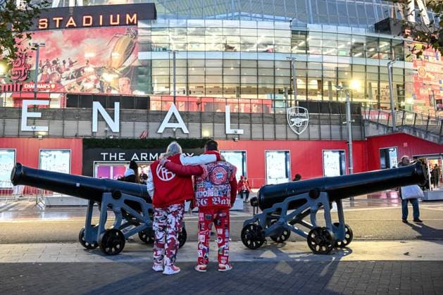 Two Bayern Munich fans arm in arm in front of the stadium during the UEFA Champions League 2025 26 League Phase MD5 match between Arsenal FC and FC Bayern München at Arsenal Stadium on November 26, 2025 in London, United Kingdom. (Photo by Harry Langer DeFodi Images)
