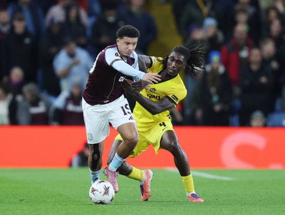 Birmingham, England, 27th November 2025. Jadon Sancho of Aston Villa tussles with Tanguy Zoukrou of Young Boys during the Aston Villa vs Young Boys UEFA Europa League match at Villa Park, Birmingham. Picture credit should read: James Baylis Sportimage EDITORIAL USE ONLY. No use with unauthorised audio, video, data, fixture lists, club league logos or live services. Online in-match use limited to 120 images, no video emulation. No use in betting, games or single club league player publications. SPI_012_JB_Villa_YoungBoys SPI-4329-0012