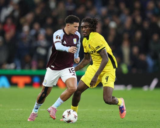 Birmingham, England, 27th November 2025. Jadon Sancho of Aston Villa tussles with Tanguy Zoukrou of Young Boys during the Aston Villa vs Young Boys UEFA Europa League match at Villa Park, Birmingham. Picture credit should read: James Baylis Sportimage EDITORIAL USE ONLY. No use with unauthorised audio, video, data, fixture lists, club league logos or live services. Online in-match use limited to 120 images, no video emulation. No use in betting, games or single club league player publications. SPI_019_JB_Villa_YoungBoys SPI-4329-0020