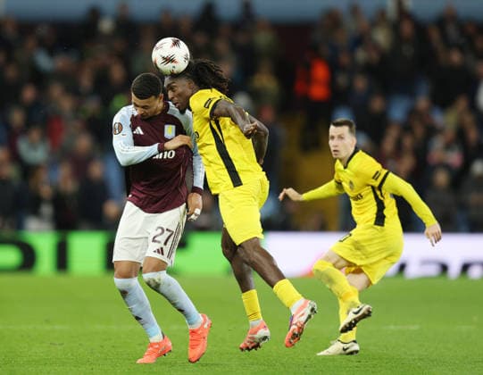 Birmingham, England, 27th November 2025. Morgan Rogers of Aston Villa challenged by Tanguy Zoukrou of Young Boys during the Aston Villa vs Young Boys UEFA Europa League match at Villa Park, Birmingham. Picture credit should read: James Baylis Sportimage EDITORIAL USE ONLY. No use with unauthorised audio, video, data, fixture lists, club league logos or live services. Online in-match use limited to 120 images, no video emulation. No use in betting, games or single club league player publications. SPI_024_JB_Villa_YoungBoys SPI-4329-0023