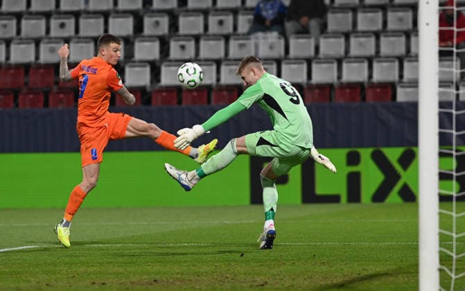 L-R Franko Kovacevic (Celje) and goalkeeper Jan Koutny (Olomouc) in action during the Football UEFA Conference League, 4th round match: Sigma Olomouc vs NK Celje in Olomouc, Czech Republic, November 27, 2025. (CTKxPhoto LudekxPerina) CTKPhotoP2025112707394  CTKPhotoP2025112707394