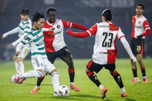 ROTTERDAM - (l-r) Reo Hatate of Celtic FC, Jordan Lotomba of Feyenoord, and Anis Hadj Moussa of Feyenoord during the Europa League match between Feyenoord and Celtic FC at Feyenoord Stadion de Kuip on November 27, 2025, in Rotterdam, Netherlands. ANP KOEN VAN WEEL UEFA Champions League Matchday 5 2025-2026 xVIxANPxSportx xxANPxIVx 543232572 originalFilename: 543232572.jpg
