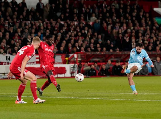 Nottingham, England, 27th November 2025. Sead Hakasabanovic of Malmo FF fires in a shot on goal during the Nottingham Forest vs Malmo UEFA Europa League match at the City Ground, Nottingham. Picture credit should read: Andrew Yates Sportimage EDITORIAL USE ONLY. No use with unauthorised audio, video, data, fixture lists, club league logos or live services. Online in-match use limited to 120 images, no video emulation. No use in betting, games or single club league player publications. SPI_014_AY_Forest_Malmo SPI-4328-0021