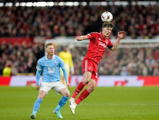 Nottingham, England, 27th November 2025. Ryan Yates of Nottingham Forest heads the ball clear during the Nottingham Forest vs Malmo UEFA Europa League match at the City Ground, Nottingham. Picture credit should read: Andrew Yates Sportimage EDITORIAL USE ONLY. No use with unauthorised audio, video, data, fixture lists, club league logos or live services. Online in-match use limited to 120 images, no video emulation. No use in betting, games or single club league player publications. SPI_041_AY_Forest_Malmo SPI-4328-0048