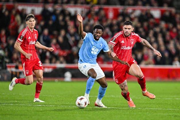 27th November 2025; The City Ground, Nottingham, England; UEFA Europa League Football, Nottingham Forest versus Malmo FF; Emmanuel Ekong of Malmo holds off Morato of Nottingham Forest  GodfreyxPitt