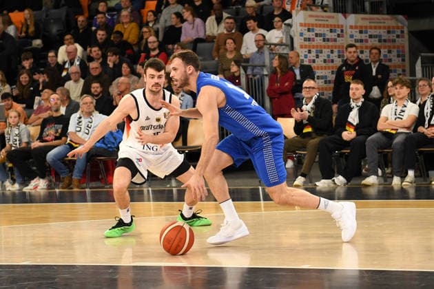 Jonas Mattisseck (15 Deutschland) and Roi Huber (13 Israel) in action at the Basketball World Cup qualifying match between Germany and Israel on November 28, 2025, in Neu-Ulm. Neu Ulm ratiopharm Arena Bavaria Germany