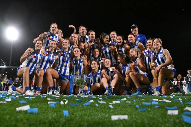 AFLW GRAND FINAL, Kangaroos players and Darren Crocker, Senior Coach of the Kangaroos celebrate with the trophy after defeating the Brisbane Lions to win the AFLW Grand Final match between the North Melbourne Kangaroos and the Brisbane Lions at Ikon Park in Melbourne, Saturday, November 29, 2025. ( NO ARCHIVING, EDITORIAL USE ONLY MELBOURNE VICTORIA AUSTRALIA  Copyright: xJAMESxROSSx 20251129154731725278