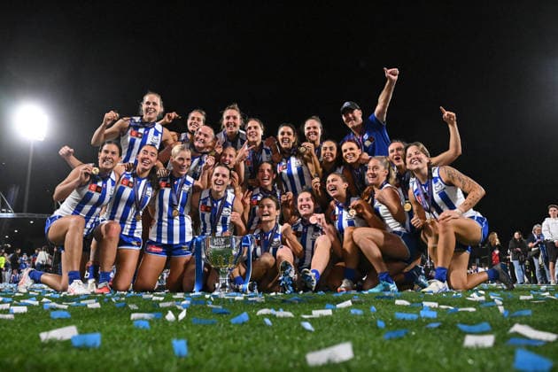 AFLW GRAND FINAL, Kangaroos players and Darren Crocker, Senior Coach of the Kangaroos celebrate with the trophy after defeating the Brisbane Lions to win the AFLW Grand Final match between the North Melbourne Kangaroos and the Brisbane Lions at Ikon Park in Melbourne, Saturday, November 29, 2025. ( NO ARCHIVING, EDITORIAL USE ONLY MELBOURNE VICTORIA AUSTRALIA  Copyright: xJAMESxROSSx 20251129185518001150